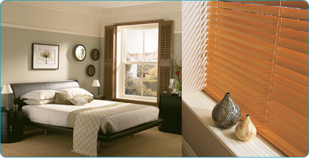 Wooden venetian blinds and window shutters in a bedroom